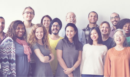 A group of 14 people smiling